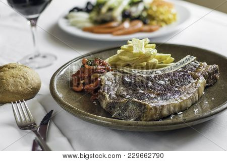 Image Of Typical Spanish Dish Barbaque Meat In A Restaurant