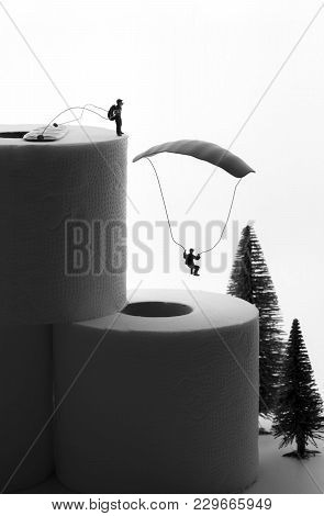 Miniature Paragliders On A Toilet Paper Mountain