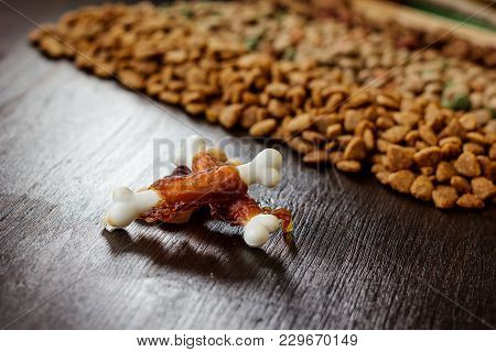 Calcium Bones For Dog Feeding On Wooden Background