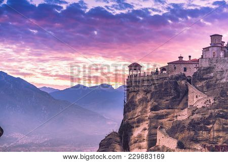 Scenic Sunset Evening Sky Over Holy Varlaam Monastery On Cliff In Meteora, Thessaly Greece. Greek De