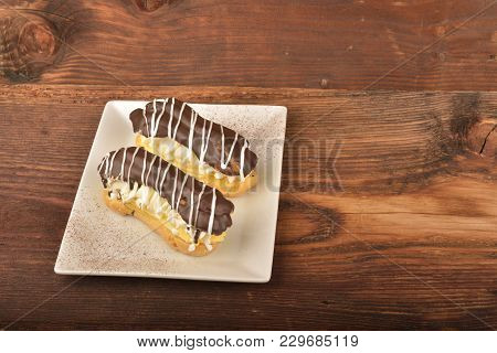 Tasty Chocolate Eclair And Cream