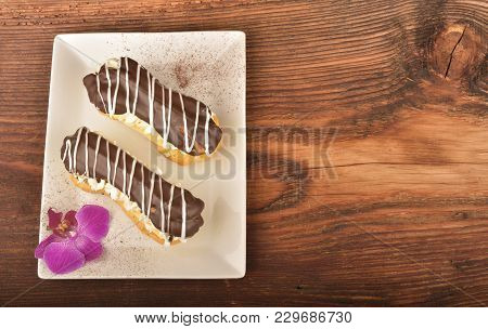 Tasty Chocolate Eclair And Cream
