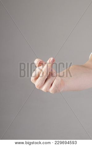 Woman Hand Showing Middle Finger On A White Isolated Background