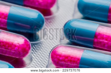 Close Up Colorful Blue, Pink Capsule With Granule In Side Pills. Pills In Blister Pack. Pharmaceutic