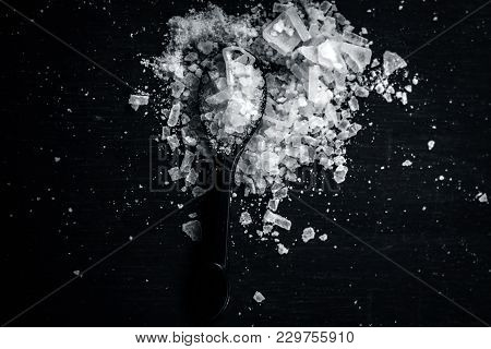 Close Up Of Aurvedic Herb Camphor Powder In A Small Spoon On Brown Wooden Surface In Dark Gothic Col