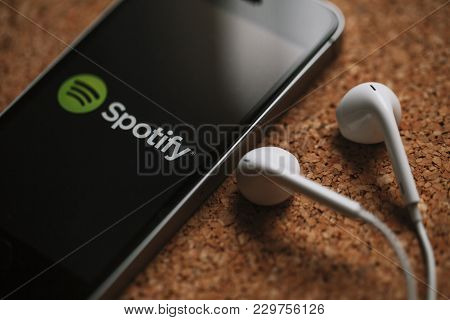 Malaga, Spain - March 5, 2018: Macro Detail Of Mobile Phone With Spotify Logo In The Screen And Whit
