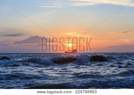 Boat Floating In The Sea For Fishing In The Sunset