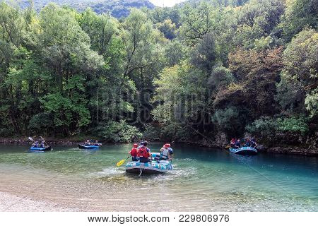 Adventure Team Doing Rafting On The Cold Waters Of The Voidomatis River In Zagori. Voidomatis River