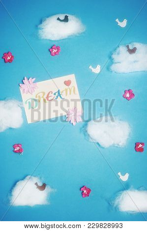 Dream Concept With Accessories On Color Background