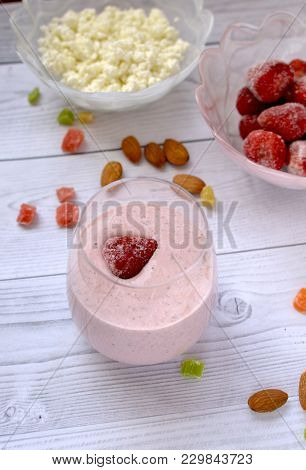Strawberry Cocktail In A Glass On A White Wooden Table