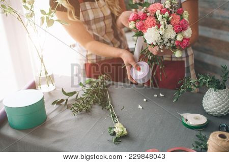 Flowers Delivery Top View. Florists Creating Order, Making Rose Bouquet In Flower Shop. Two Female F