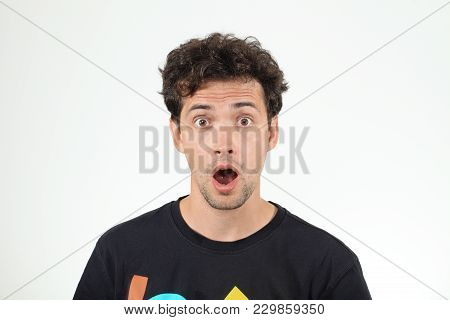 Surprising Young Man In Black Shirt Opening His Mouth