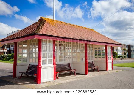 Victorian wooden sea front shelter and seating at popular seaside resort Bexhill-on-Sea in East Sussex South East England UK