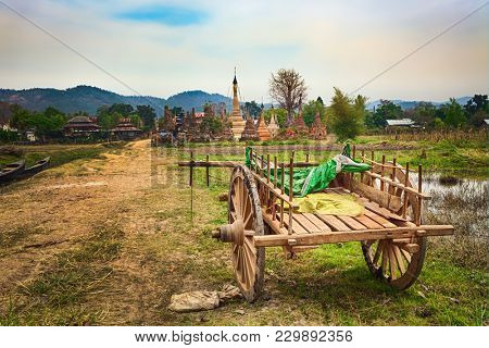 Buddhist temple Sankar.  Oxcart on the foreground. Shan state. Myanmar. 