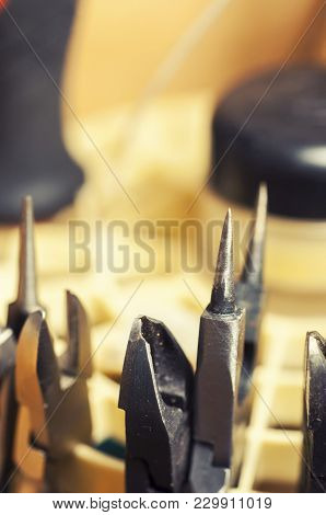Different Goldsmiths Tools On The Jewellery Workplace. Needle-nose Pliers
