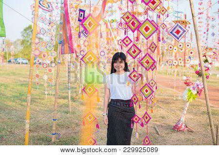 Woman Travel Around Tung Flag Festival In Phra That Ya Khu Pagoda At Kalasin,thailand