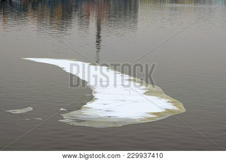 Spring Is Coming. White Melting Ice Floe Floating In The River In The City. Kyiv, Ukraine.