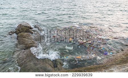 Garbage On The Baech,beach Pollution. Plastic Bottles And Other Trash On Sea Beach