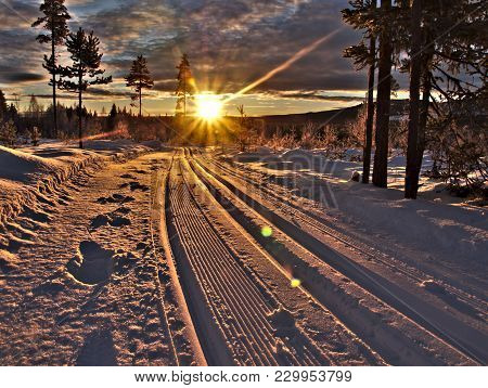 Sunbeams On Fresh Prepared Ski Run In Evening