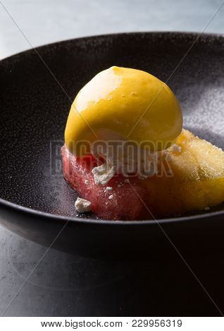 Sorbetto Ice Cream Served On A Black Bowl