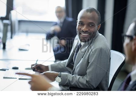 Selective Focus Of Multicultural Businessmen Having Conversation At Workplace In Office