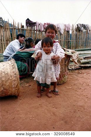 Chiang Mai Province / Thailand - Circa 2000: Two Small Girls Pose For A Photograph In A Small Lisu V