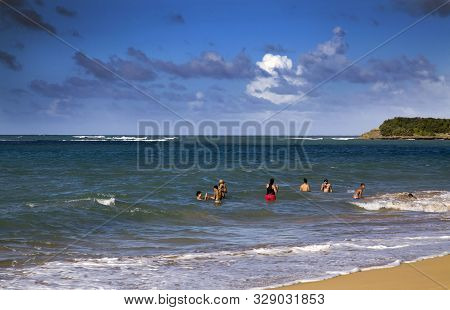 Pinones, Puerto Rico/usa - February 10, 2019: Beach Swimmers Enjoy The Beach Water On The Northeast 