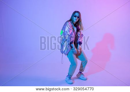 Young Stylish Girl Dancing In The Studio On A Colored Neon Background. Music Dj Poster Design.