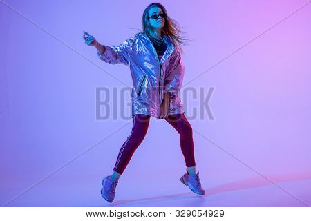Young Stylish Girl Dancing In The Studio On A Colored Neon Background. Music Dj Poster Design.