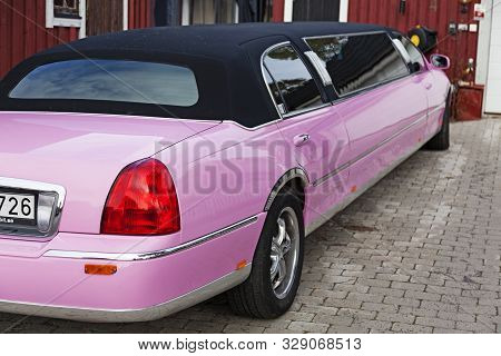 Umea, Sweden - September 15, 2019: A Pink Limousine Stands On The Garage Driveway