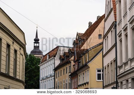 Traditional Colorful Houses And Church Tower In The Old Town Of Stralsund