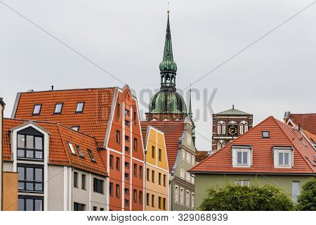 Traditional Colorful Houses And Church Tower In The Old Town Of Stralsund