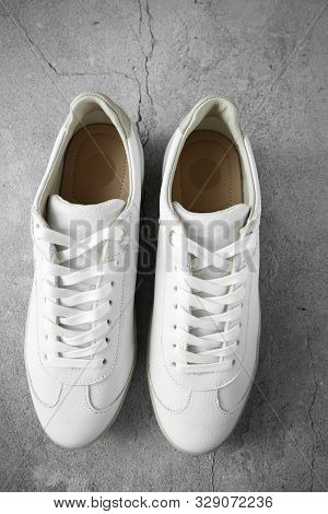 White Plimsolls Made Of Tumbled Leather, Matching Laces, Fabric Lining And Lightweight Platform Sole