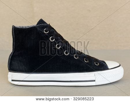 Close Up Vintage Style Of Sport Black Sneaker Shoe On Gray Background