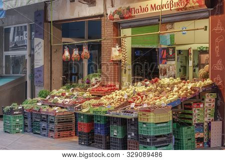 Thessaloniki, Greece - October 16 2019: Greek Greengrocer Shop With Fruits. Illuminated View Of Stor