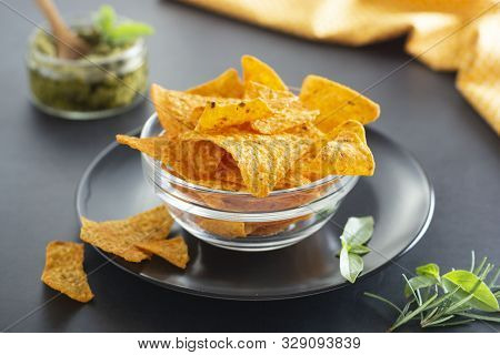 Nachos Chips Or Corn Mexican Chips In Glass Bowl, Isolated Healthy Food Snack Dark Background