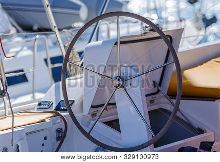Control Wheel Sailing Yacht Without People. Depth Of Field Blur
