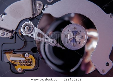 top view inside of hard disc or PC disc drive, close up or macro photography of hard drive show cyli