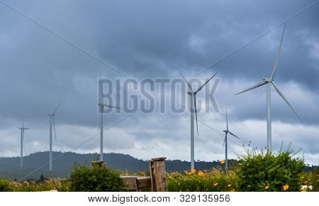 Turbine In Farm With Incoming Thunder Storm