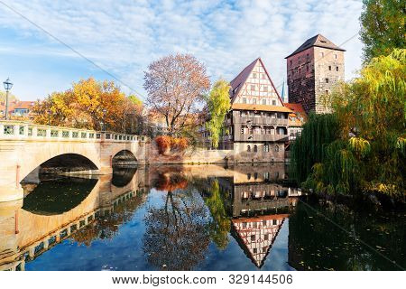 Old Town Of Nuremberg With Half-timbered Houses Over Pegnitz River Water With Reflections, Germany
