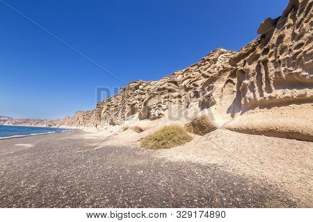 Canyon Mountains And Sea With Black Volcanic Beach On Vlychada.