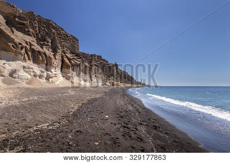Canyon Mountains And Sea With Black Volcanic Beach On Vlychada.