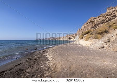 Canyon Mountains And Sea With Black Volcanic Beach On Vlychada.
