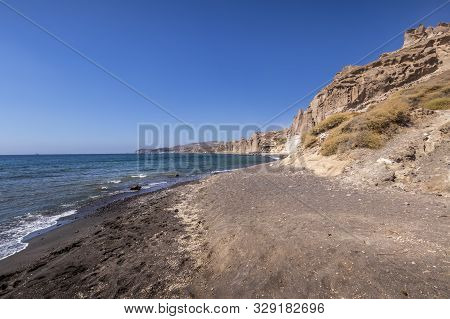 Canyon Mountains And Sea With Black Volcanic Beach On Vlychada.