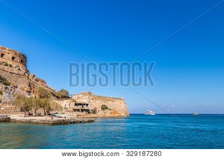 Spinalonga Fortress On A Clear Sunny Day. The Ruins Of Leprosolium.