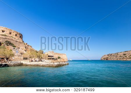 Spinalonga Fortress On A Clear Sunny Day. The Ruins Of Leprosolium.