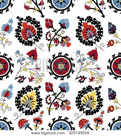 Seamless Colored Ethnic Flowers And Leaves Pattern On White Background. Designed For Textile Prints.