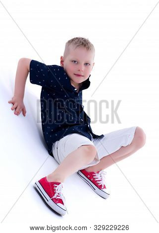 Cute Little Boy Studio Portrait On White Cyclorama. The Concept Of A Happy Childhood. Isolated On Wh