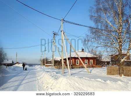Russian Village In Winter. View Of The Snow-covered Street. Village Of Visim, Sverdlovsk Region, Low