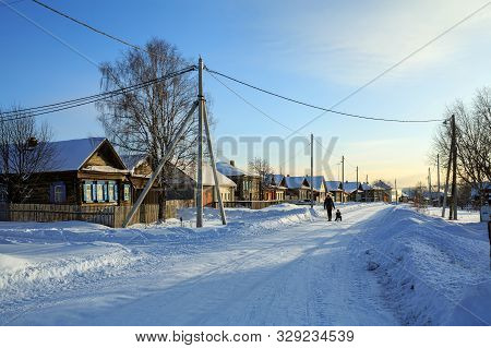 Russian Village In Winter. View Of The Snow-covered Street. Village Of Visim, Sverdlovsk Region, Low